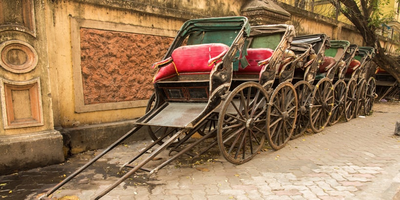 traditional hand pulled indian rickshaws parked